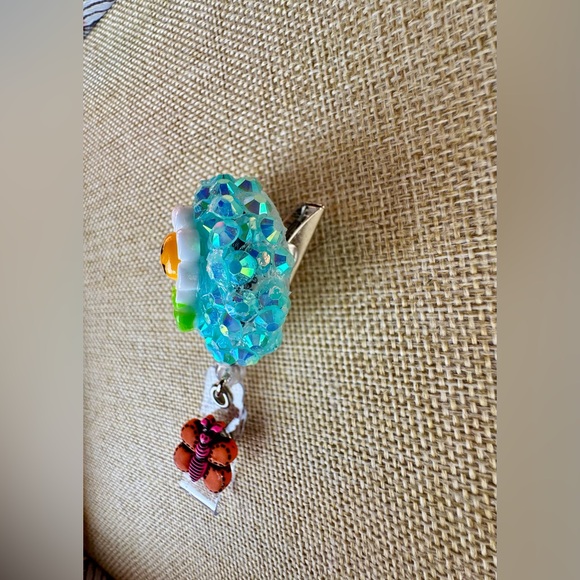 Smiling Daisy Glitter Badge Reel with Orange Butterfly Charm - Picture 2 of 4